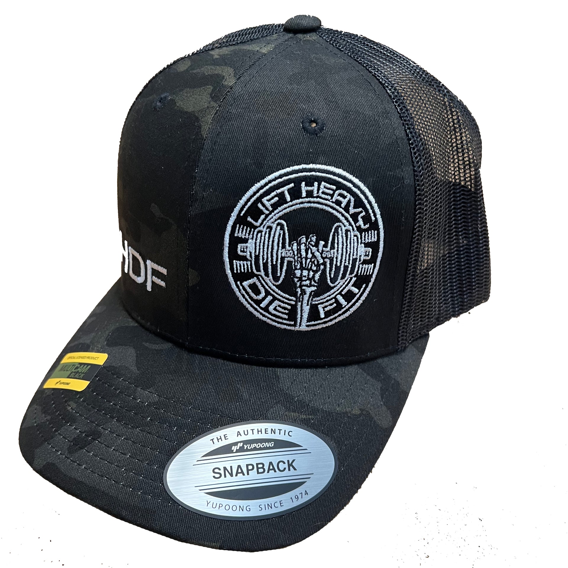 Lift Heavy Die Fit embroidered camo trucker cap left side view showing mesh back panel and plastic snapback closure for gym wear